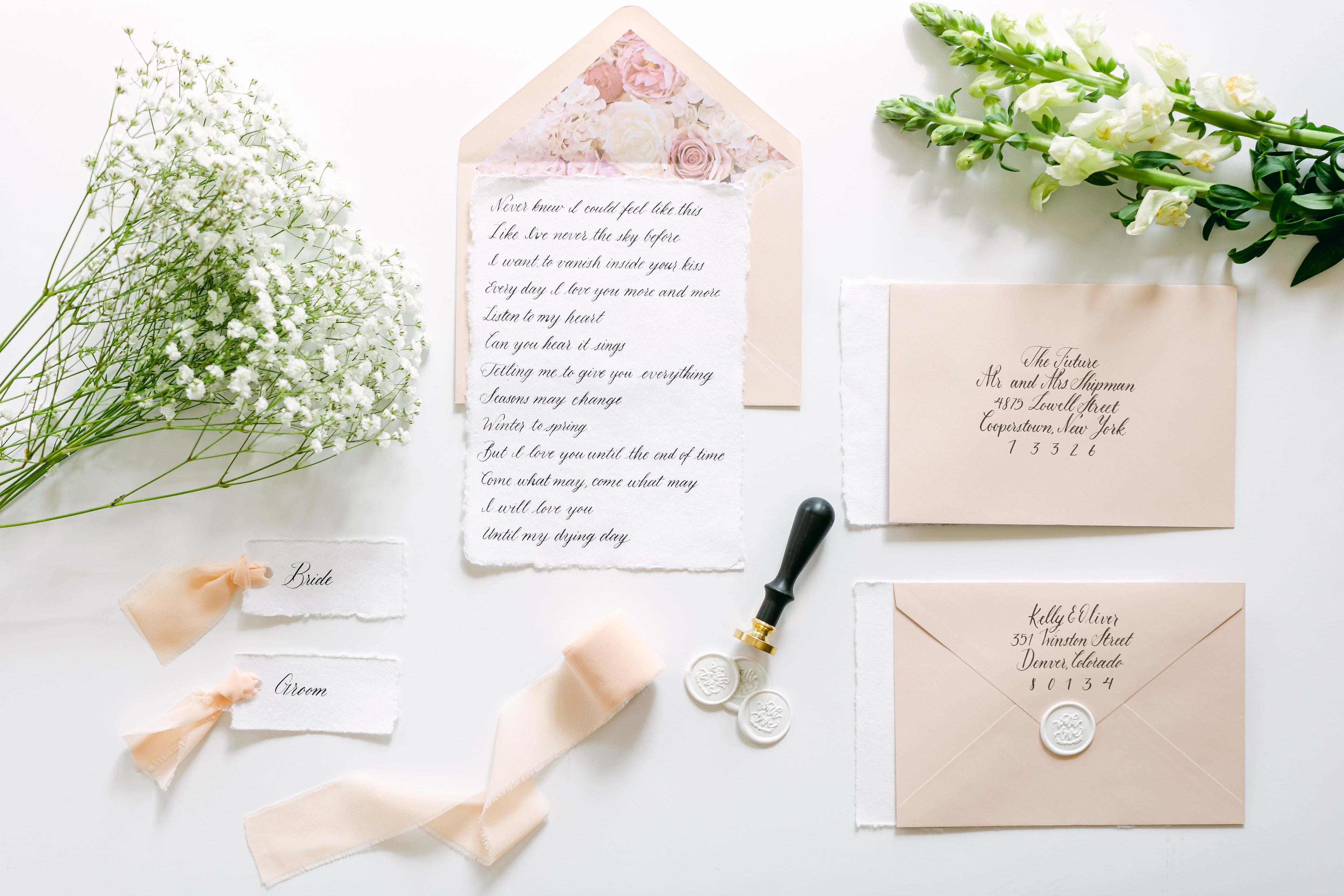 custom calligraphy suite featuring envelope calligraphy, placecard calligraphy, and scripted vows from colorado calligrapher Sparrow and Ink Designs
